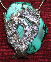 Sterling silver pony head and feathers on turquoise